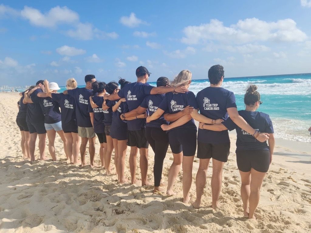 STRIVE team on the beach in Cancun