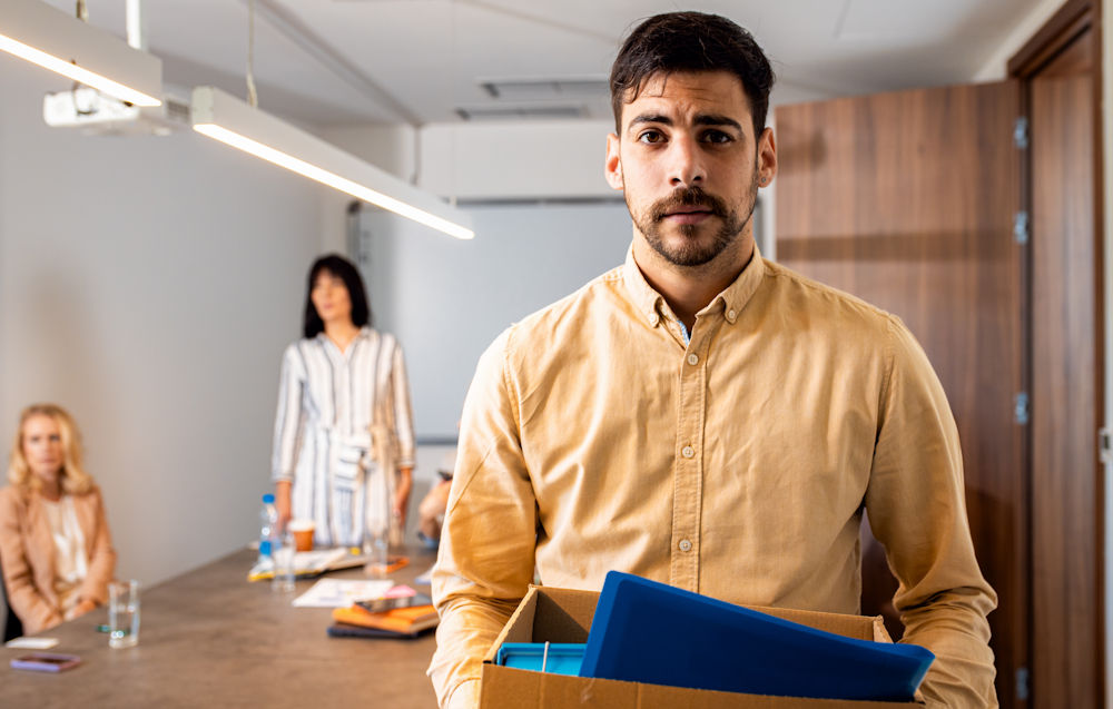 man holding box with belongings