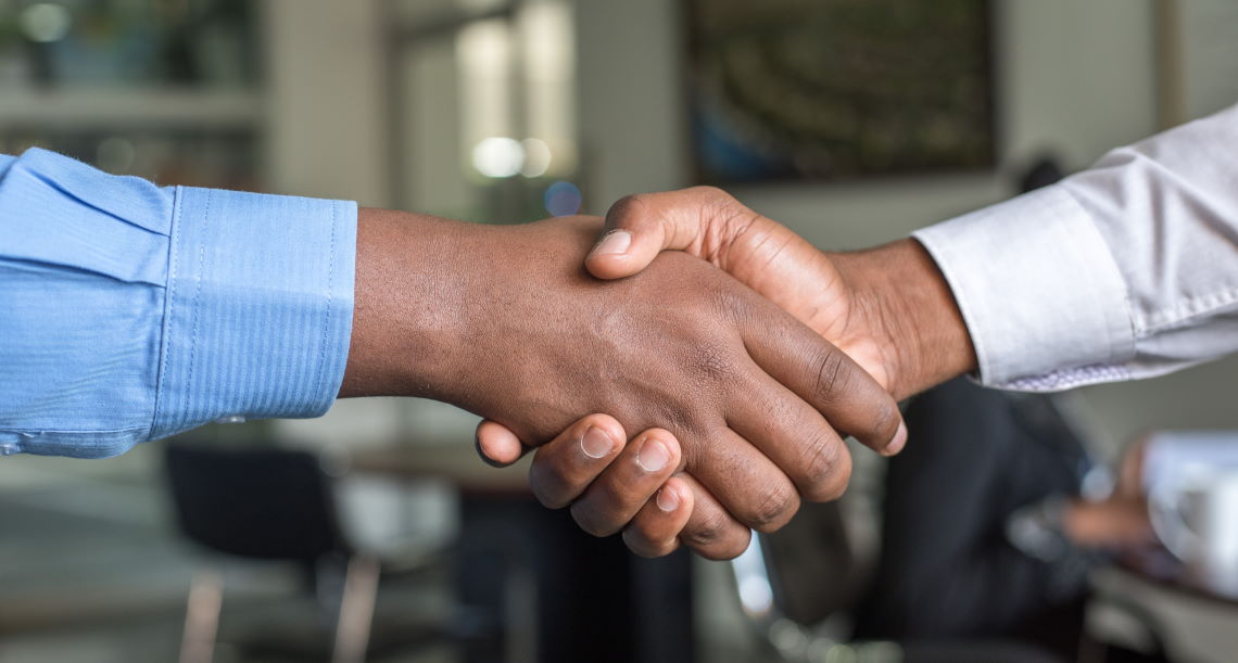 two men shaking hands