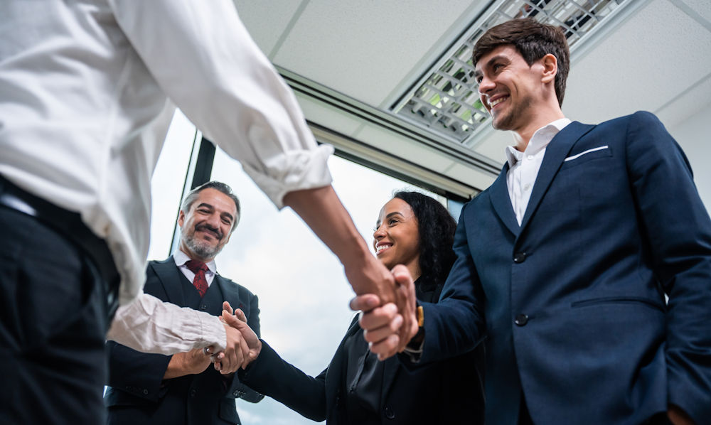 shaking hands of new hires
